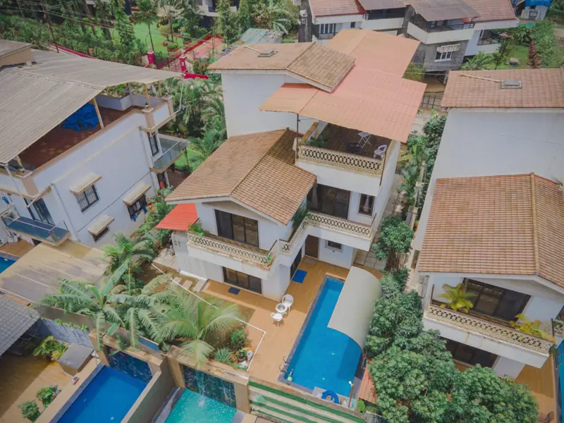 Top-down drone view of the villa and pool