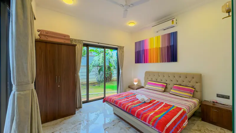 Ground-floor bedroom with glass doors onto the garden