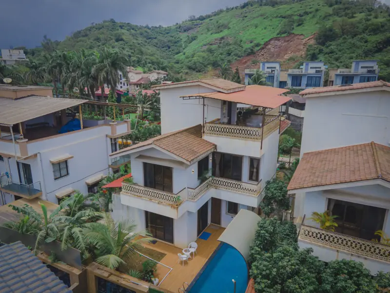 Drone view of the villa with hills behind