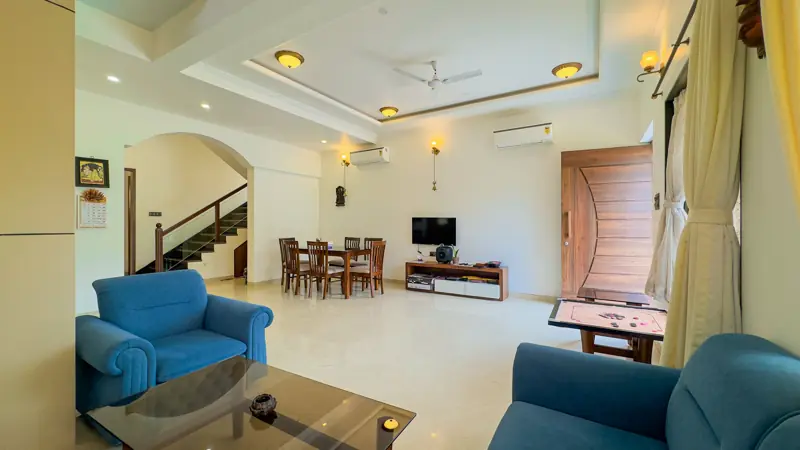 Living room with carrom and a smart TV